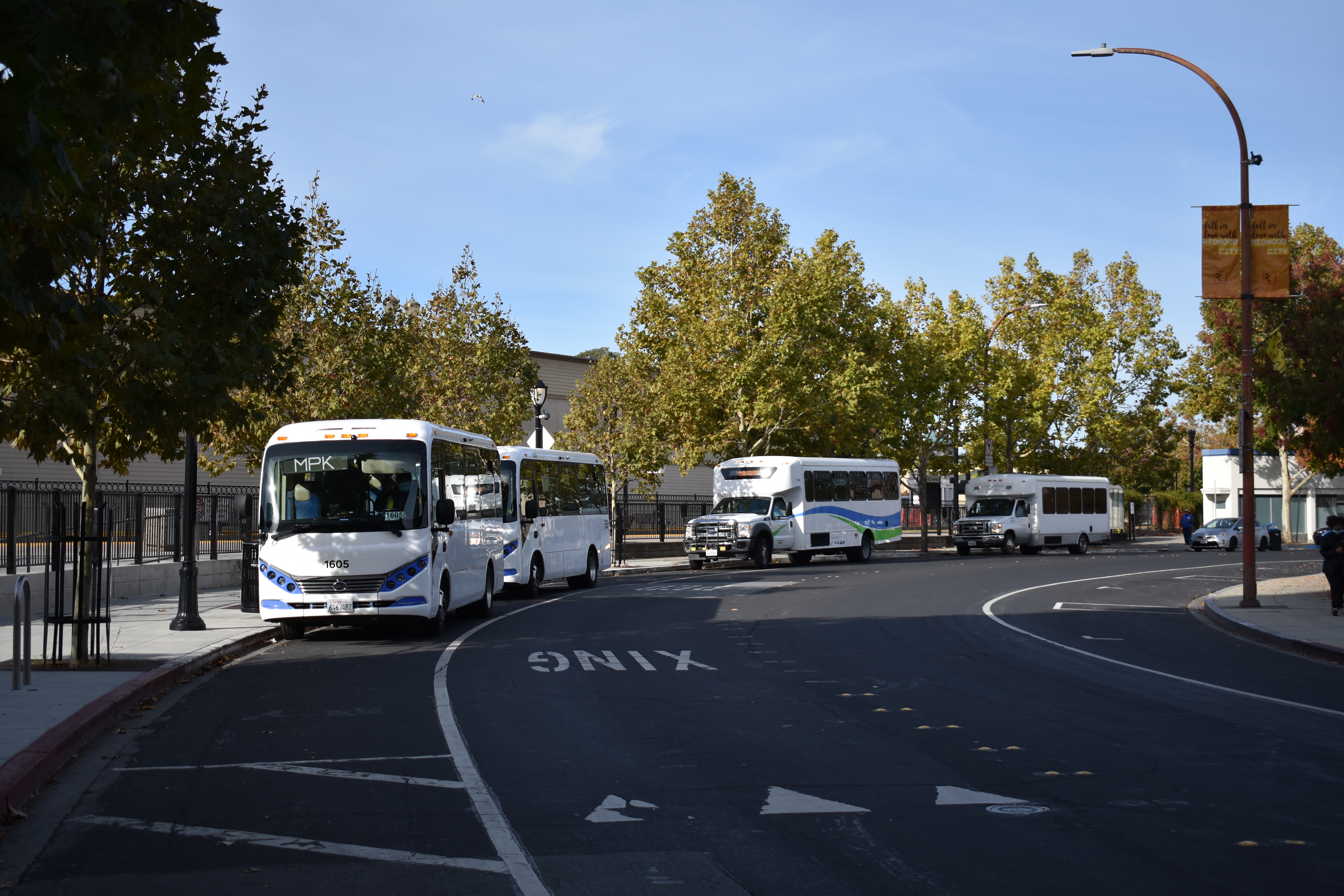 Picture of multiple shuttles at the Redwood City Caltrain Station