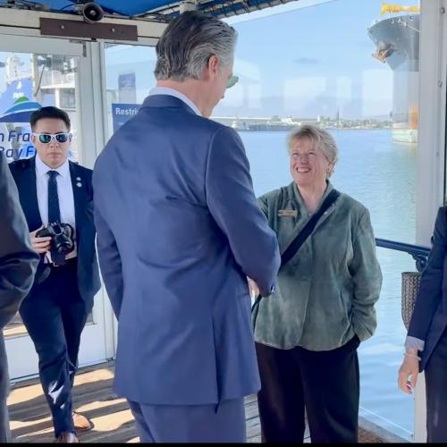 Gov. Newsom greets SamTrans Board Chair Marina Fraser and SamTrans General Manager/CEO April Chan in Oakland.