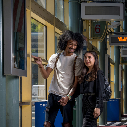 Couple posing at the SF Caltrain Station